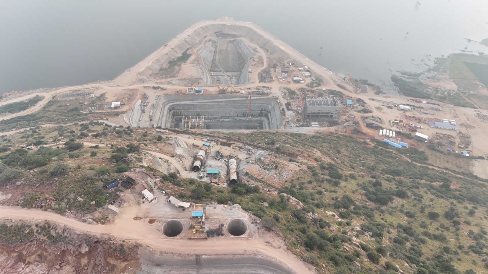 Aerial view of tunnel portals and surge pool excavation at the PSP Chitravathi project